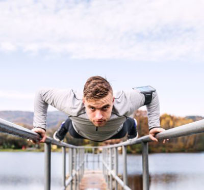 An athlete moving across a bridge