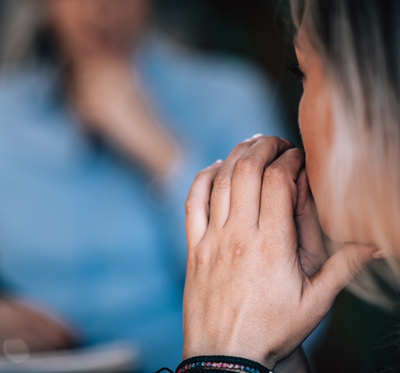 A woman speaking to a mental health professional