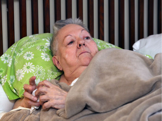 Carolyn Boismier lying in her bed