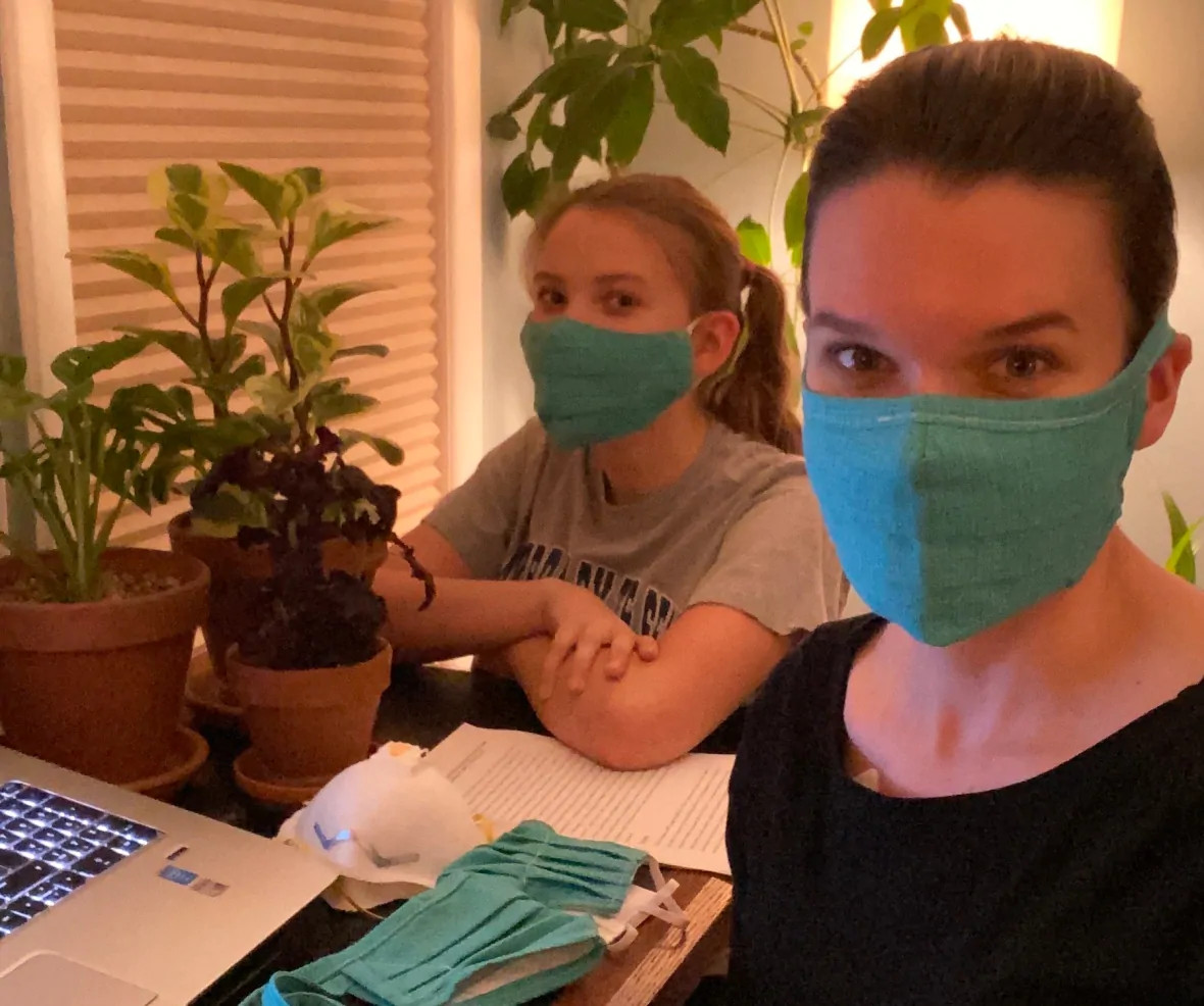 Karen and Sarah Harris wearing blue facemasks