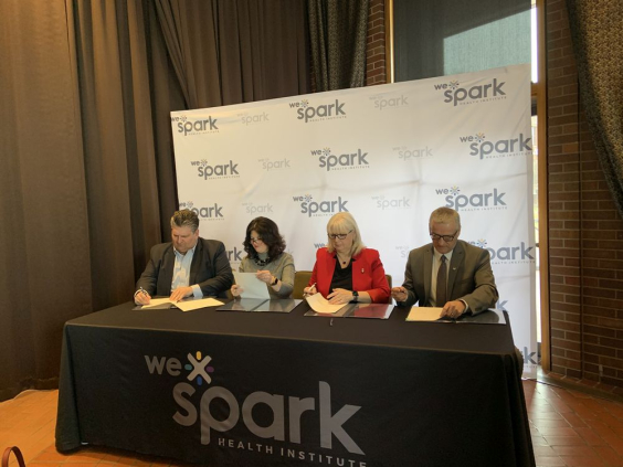 Windsor Regional Hospital President and CEO David Musyj, St. Clair College President Patti France, Janice Kaffer, Hotel Dieu Grace Healthcare President and CEO, University of Windsor President and Vice-Chancellor Robert Gordon sign memorandum of understanding launching a regional health institute.